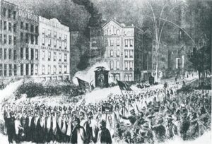 Wide awakes in uniforms carry torches in a march in Chicago.